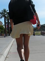 23 pictures - Young blonde in white mini on the street. Real upskirt