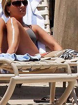 12 pictures - Bikini beauties play on the beach