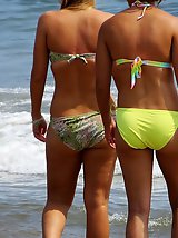 12 pictures - Nice butted girls in colorful bikinis