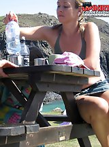 24 pictures - Sitting upskirt, of a nice blonde in mini skirt