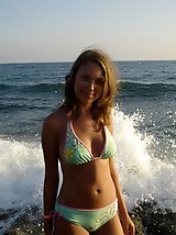 24 pictures - A girl removing her micro bikini at the Peka Peka