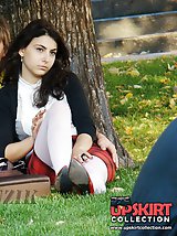 12 pictures - Hot brunette shows stockings up skirt