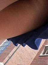 12 pictures - Pretty brunette in blue skirt. Candid street upskirt