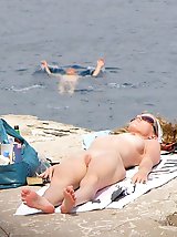 12 pictures - Smiling nudists erotic tease on cam